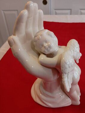 Porcelain Angel Sleeping in Hand Figurine